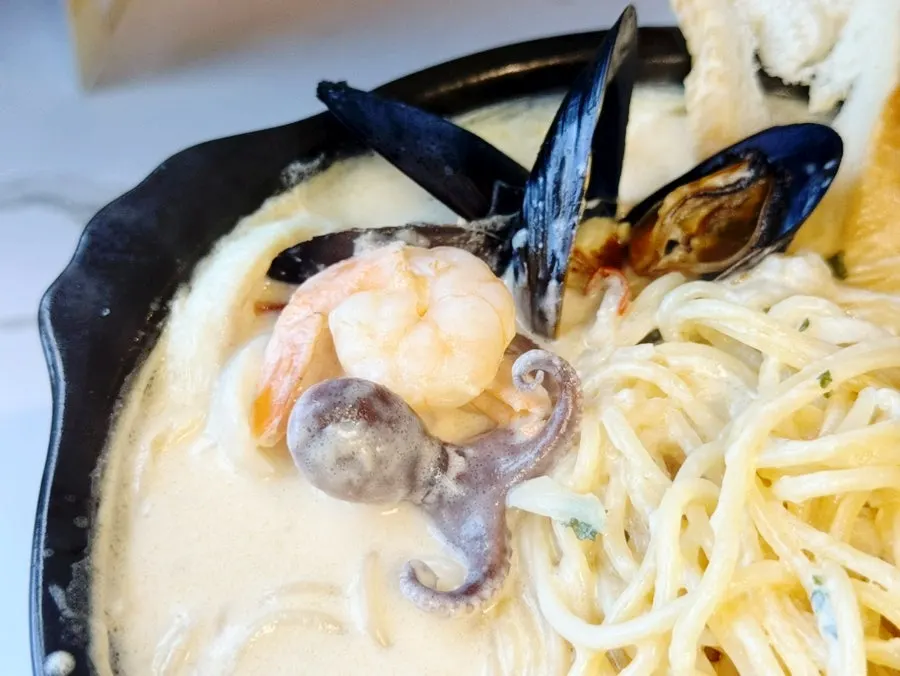 Plate of cheongyang cream risotto topped with seafood