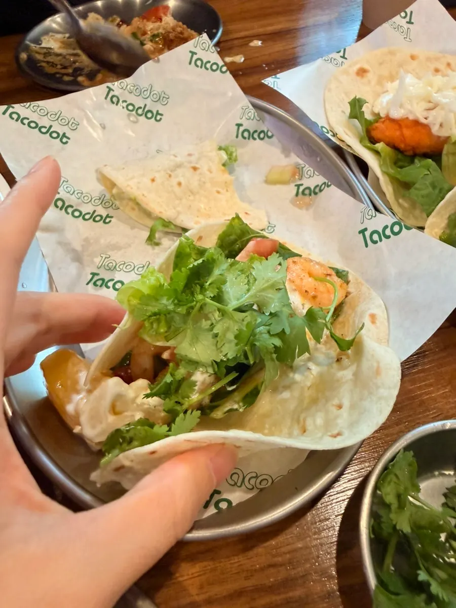 Close-up of mango shrimp taco in a tortilla