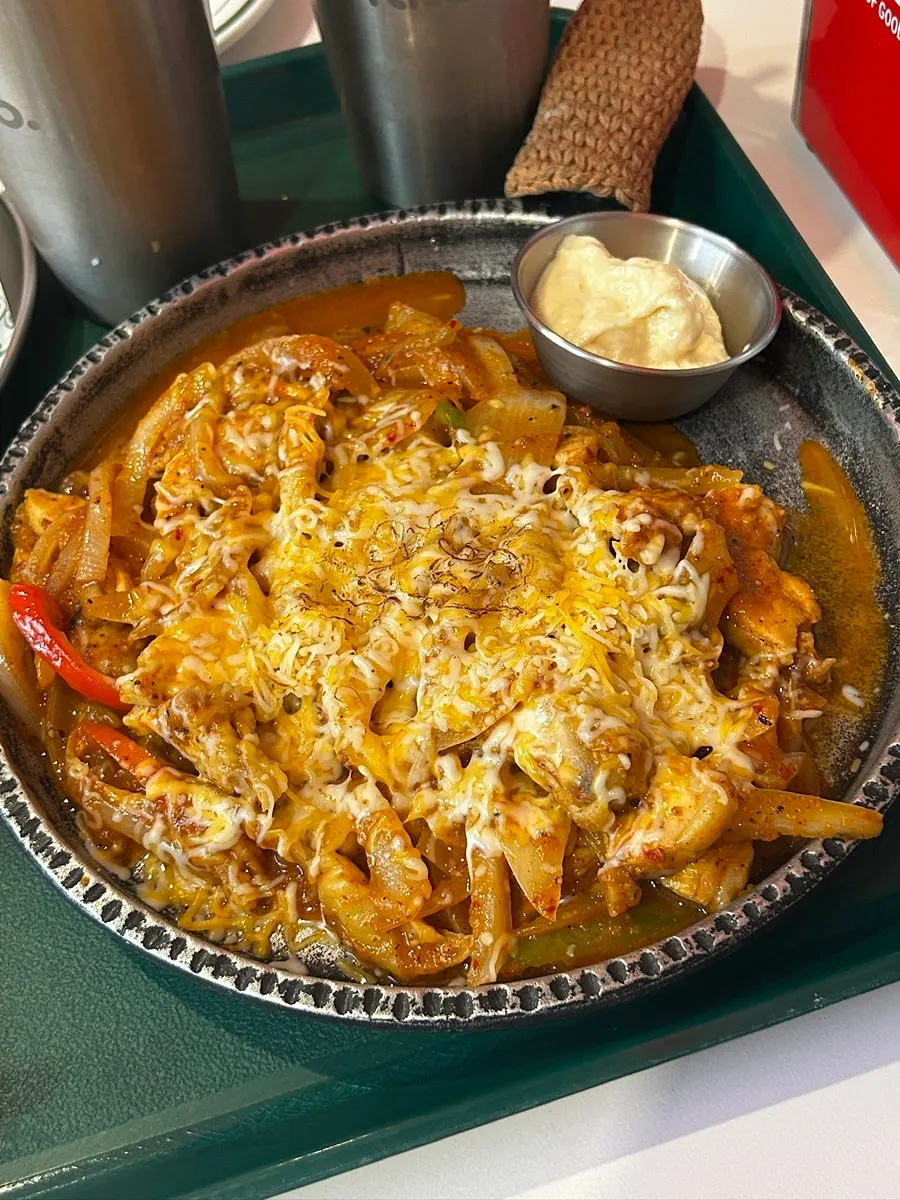 Fajita platter served with tortillas and coleslaw