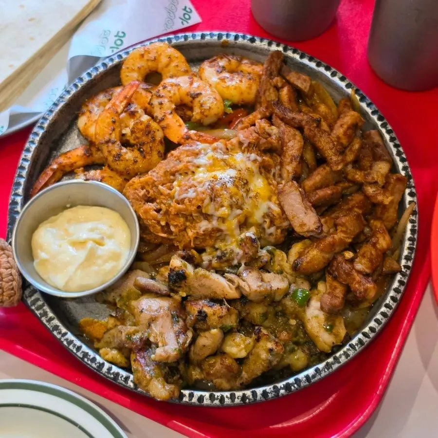 Fajita platter loaded with meat and shrimp