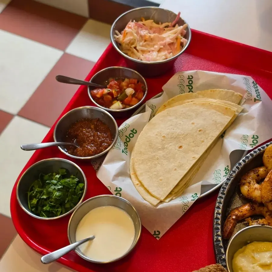 Taco Dot table set with cola and food