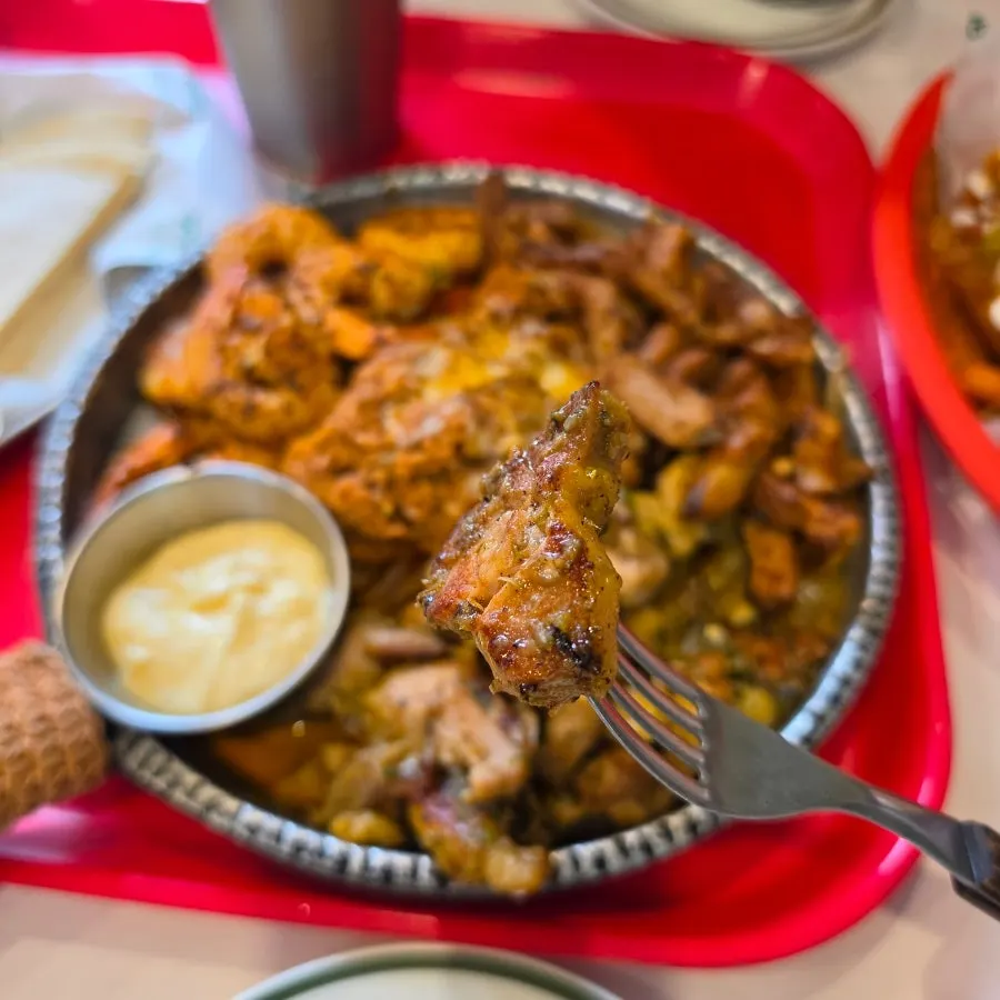 Meat from the fajita platter wrapped in a tortilla