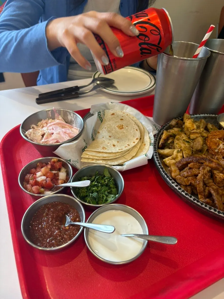 Tortilla topped with both meat and shrimp