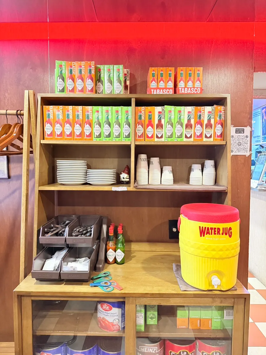 Tabasco boxes and flags displayed as decor at Taco Dot