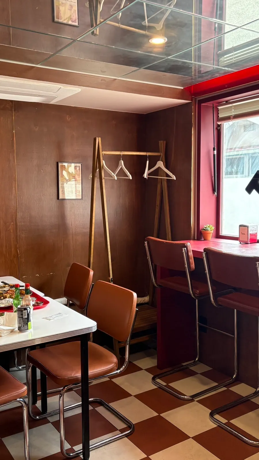 Window-side table in Taco Dot's inner room-like space
