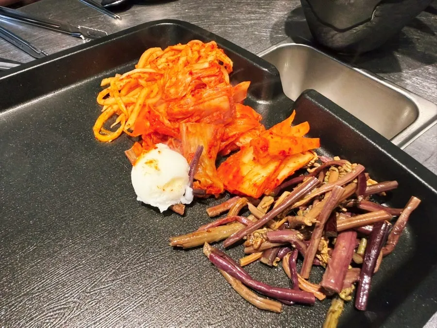 Lard piece and grilling vegetables on the pan
