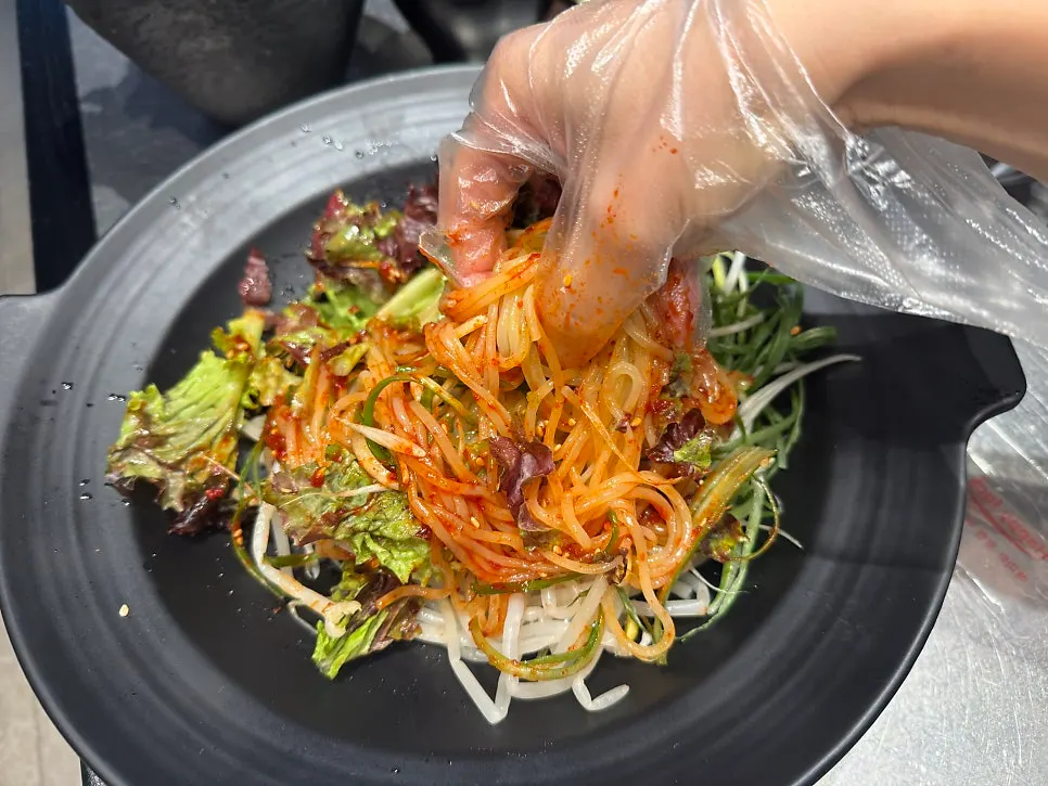 A plate of sweet-and-tangy jjolmyeon served as a free side