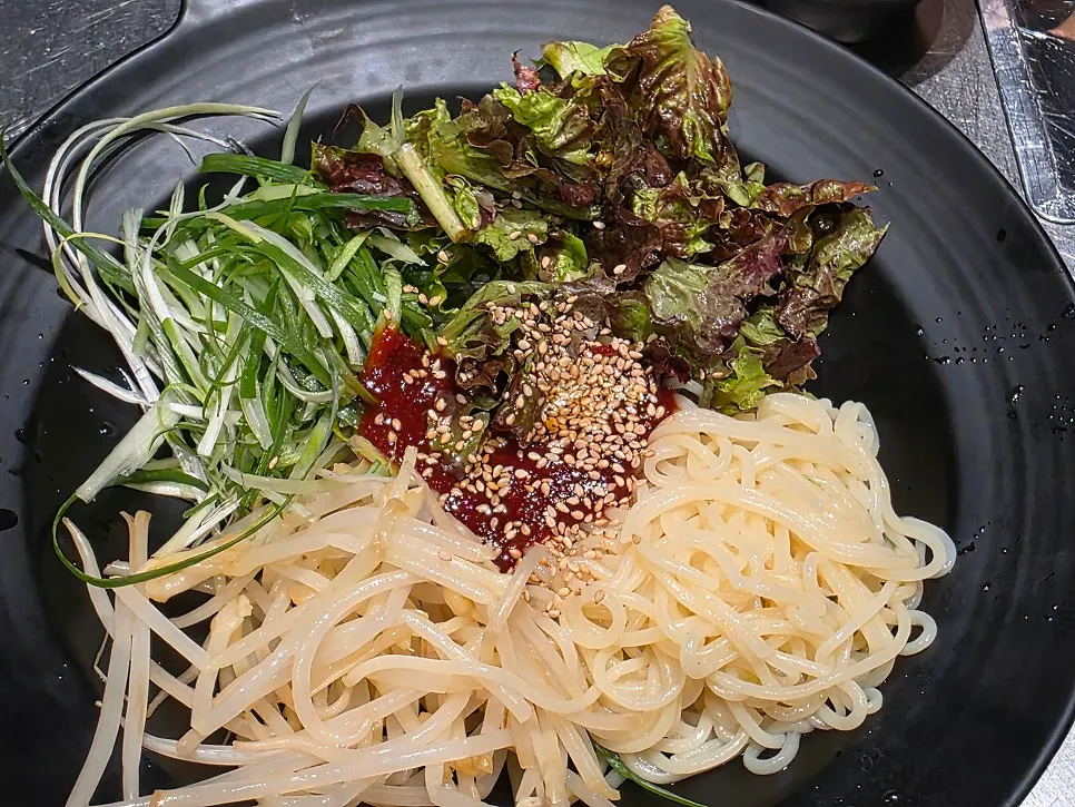 Free spicy-sour jjolmyeon noodles served as a side