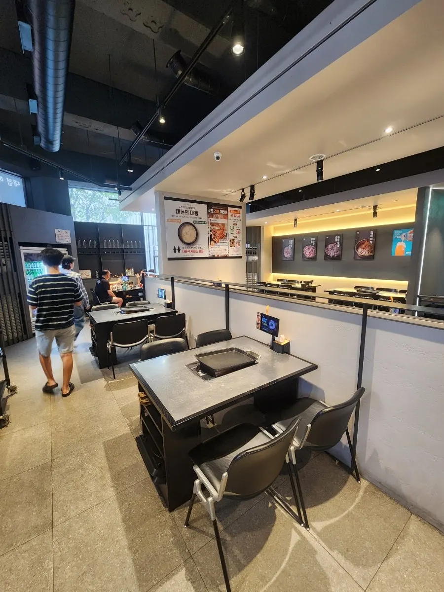 Taedon menu boards set up on both sides of the entrance