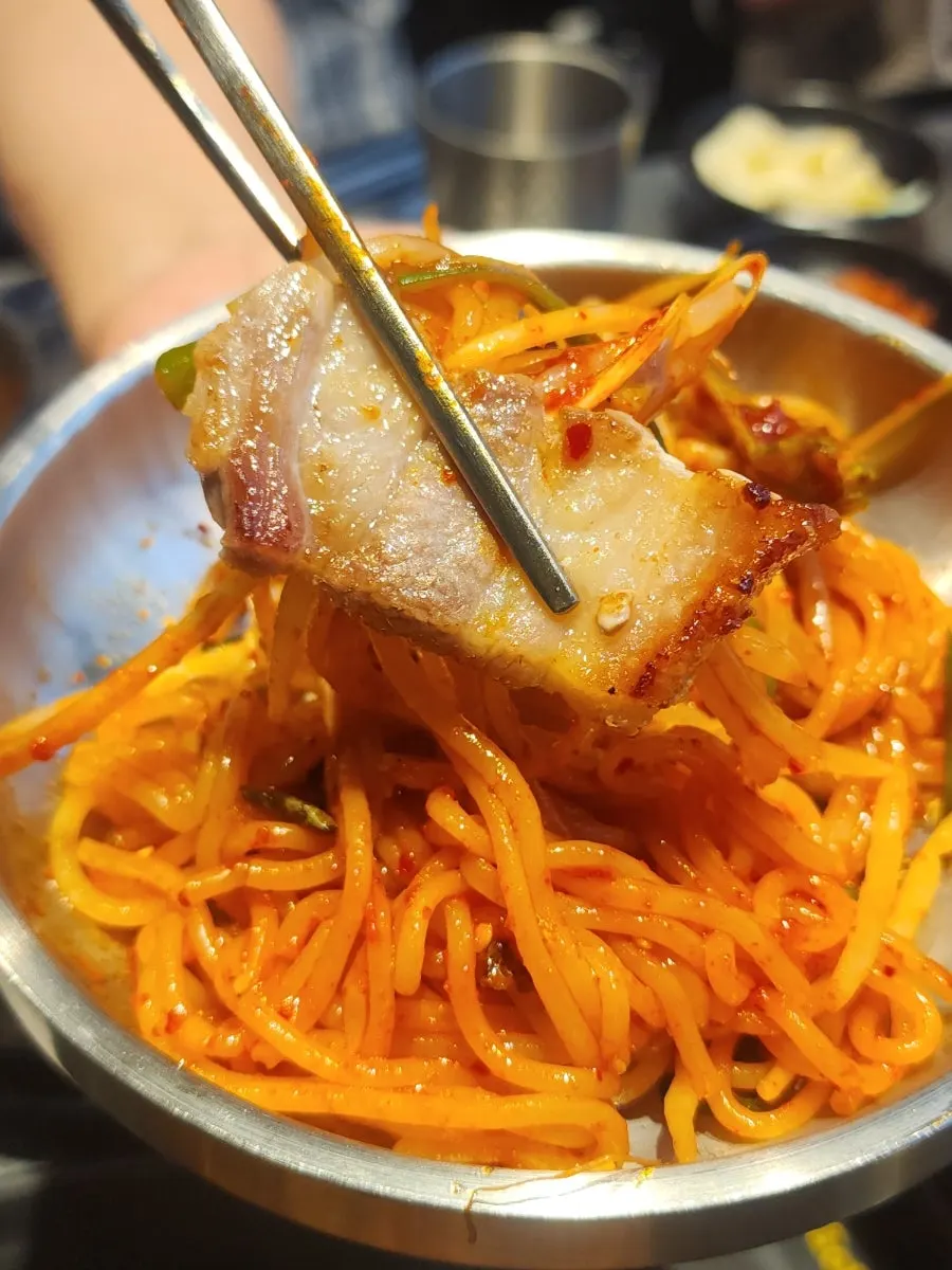 Pork belly grilling to a golden brown