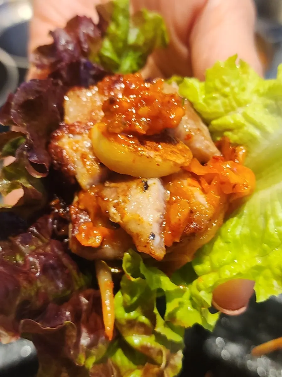 Pork belly wrapped in lettuce