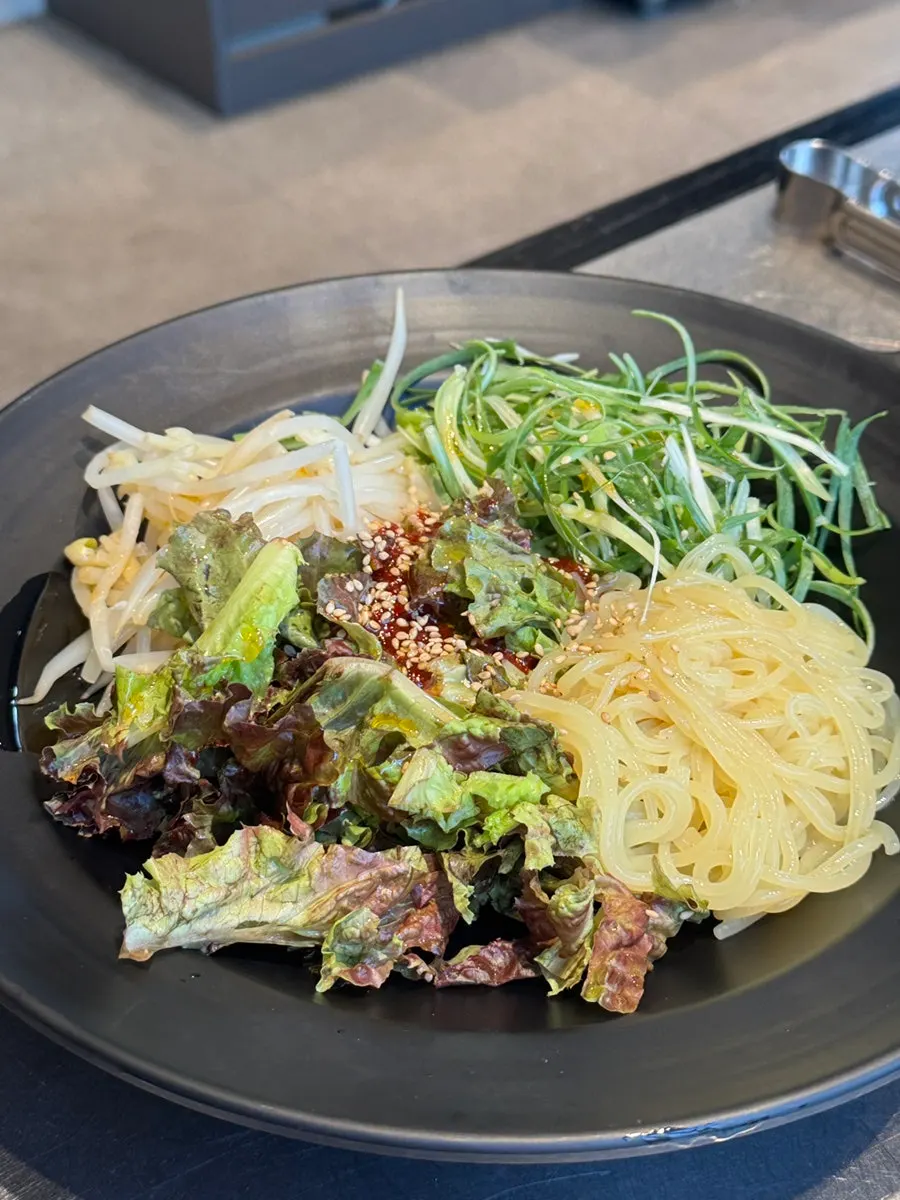 A bowl of jjolmyeon served as a side dish at Taedon