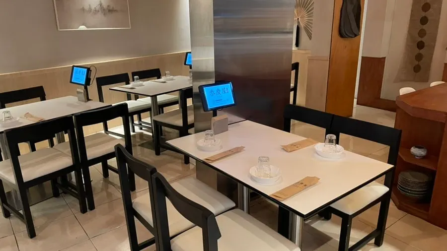 Table seating and lighting inside Taegyeongok