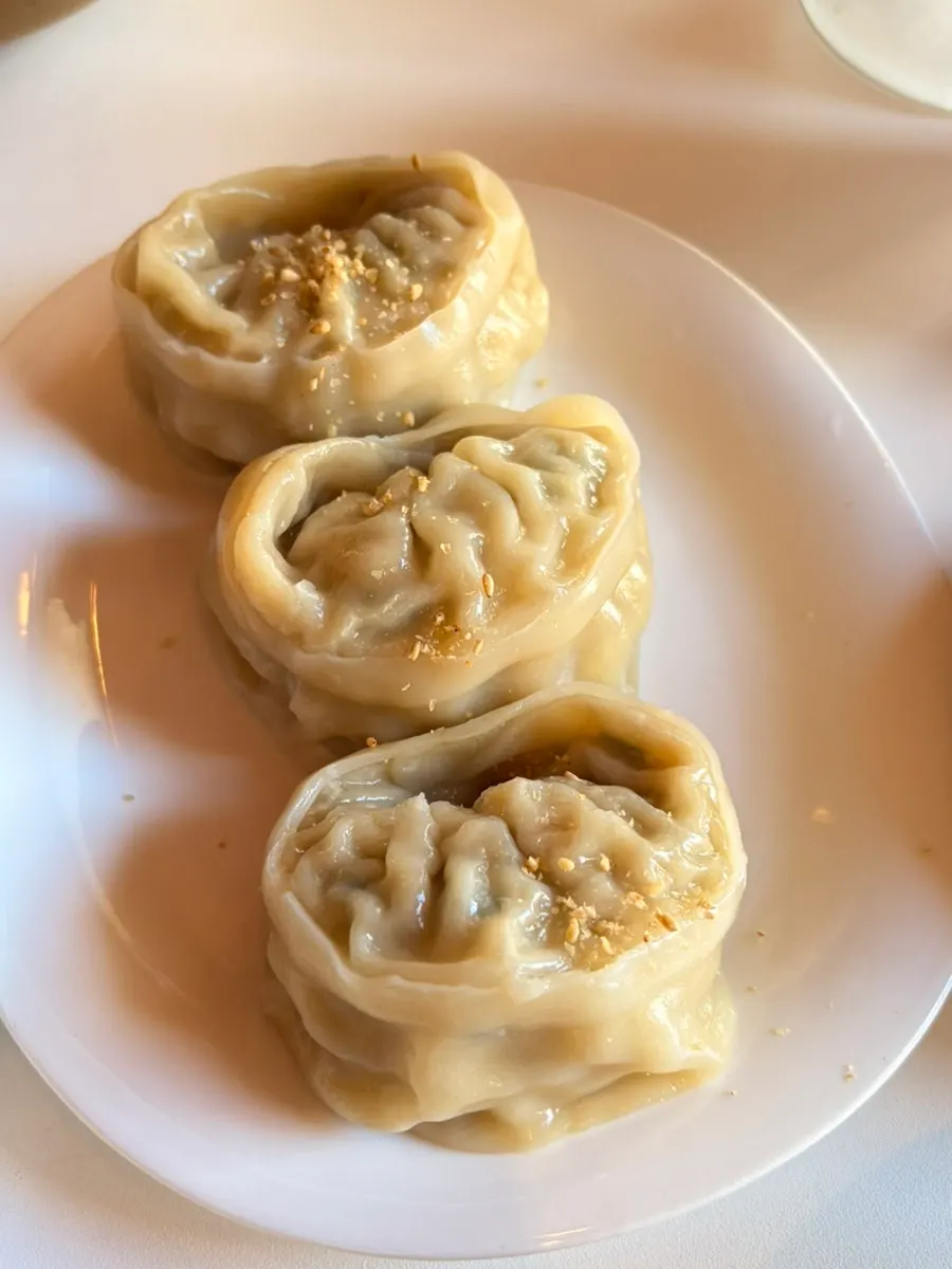 A plate of Taegyeongok's half-and-half kimchi and meat dumplings