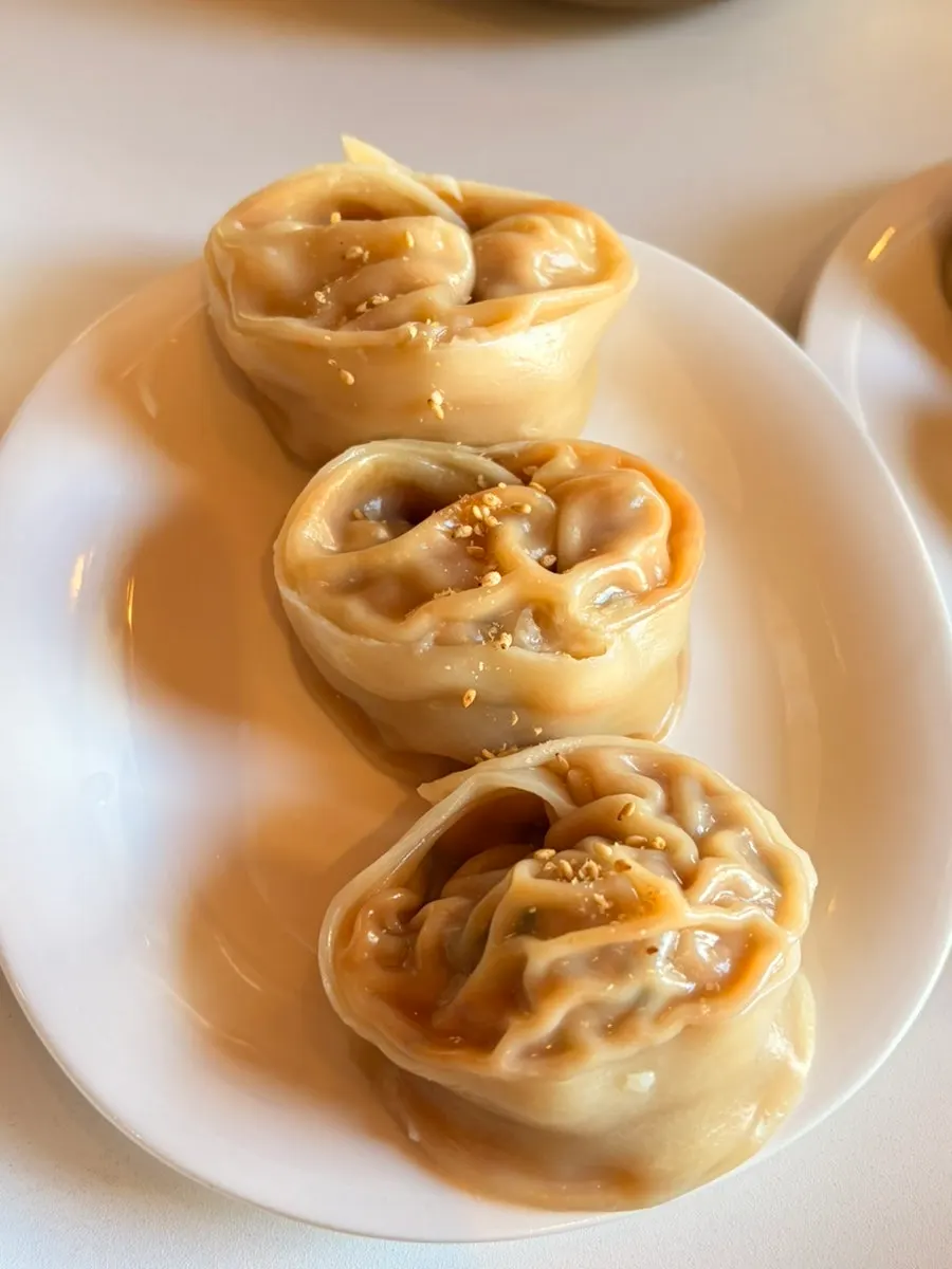 Cross-section of a meat dumpling packed full of filling
