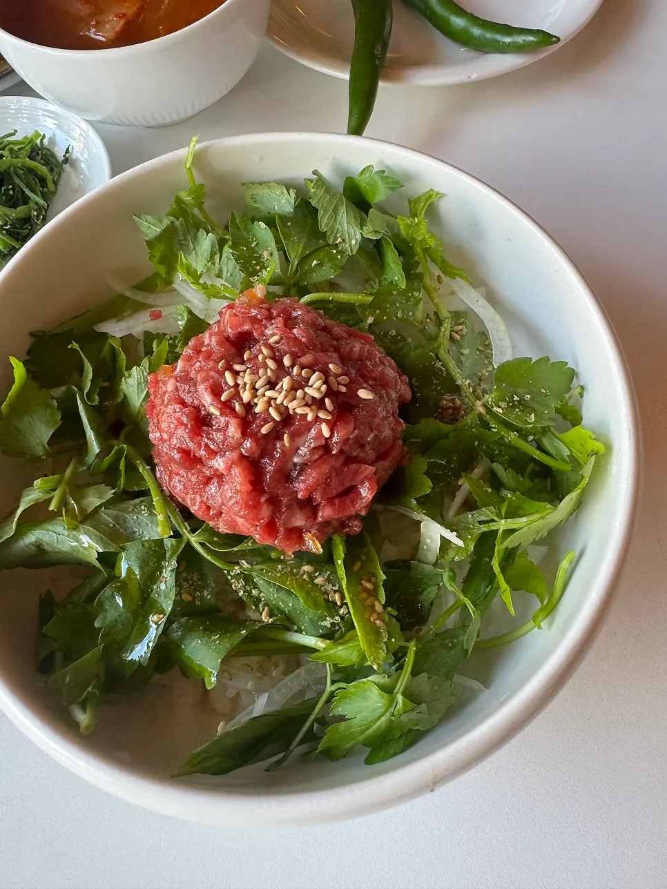 Beef soup served with the yukhoe bibimbap