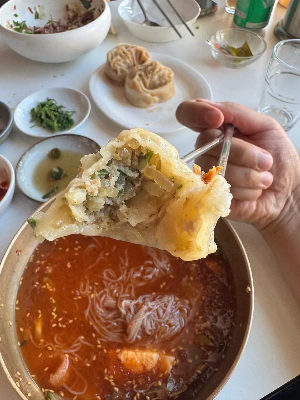 Cross-section of a kimchi dumpling packed full of filling
