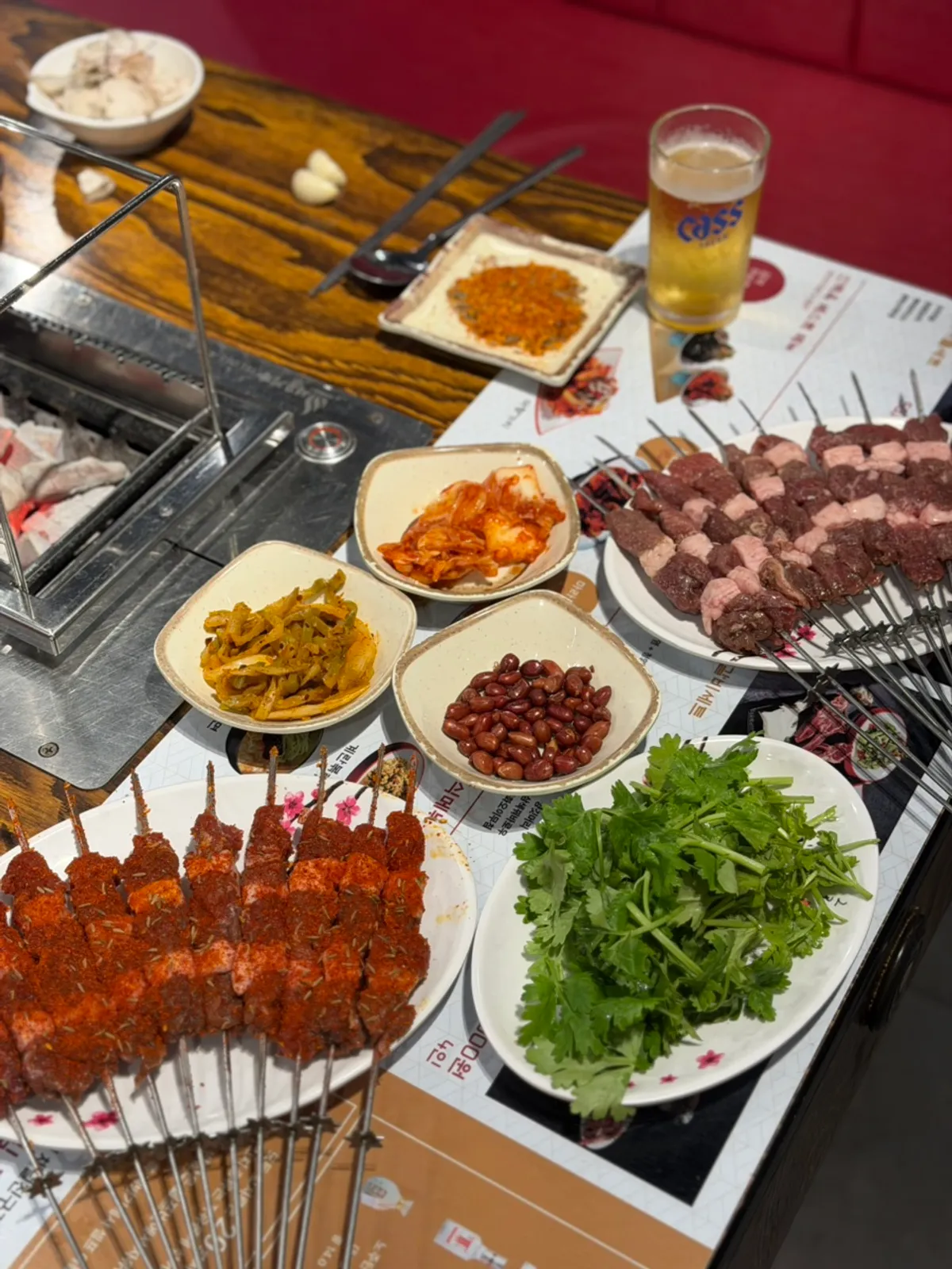 Table spread of lamb skewers at Sinbaegok Lamb Skewers Taejeon Branch