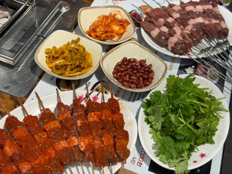 Full couple set spread with lamb skewers and guobaorou