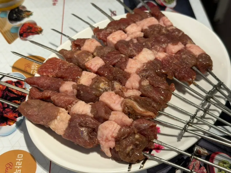 Ten bright red original lamb skewers