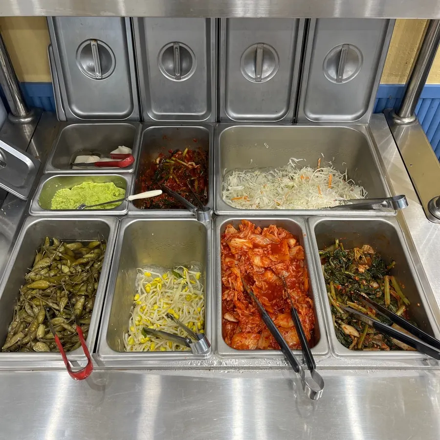 Self-serve corner with barley rice and side dishes