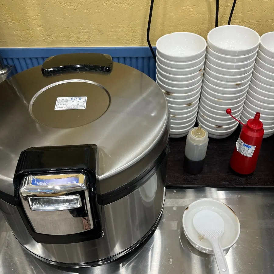 Seasoned greens laid out at the self-serve corner