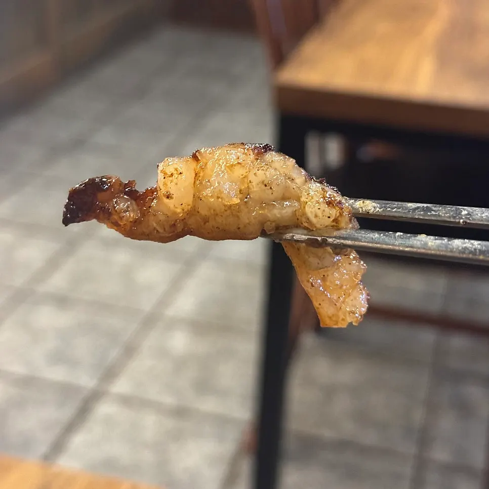 Grilled gopchang served with a glass of beer