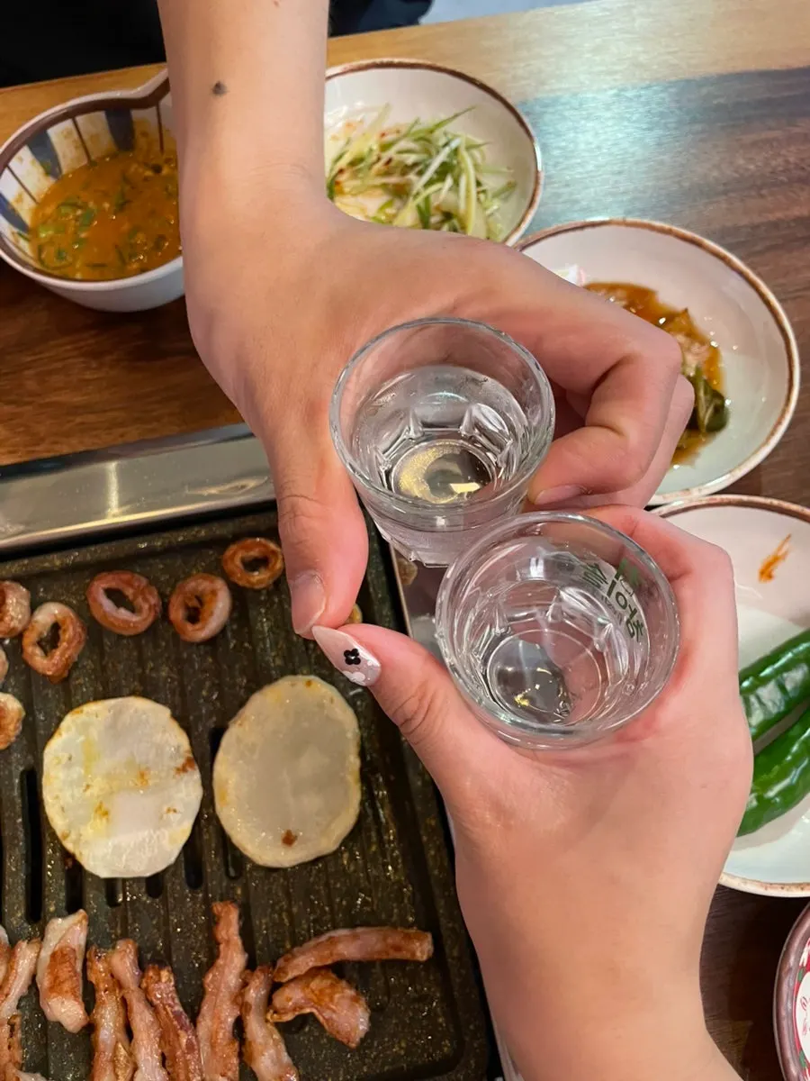 Soju glass alongside the makchang