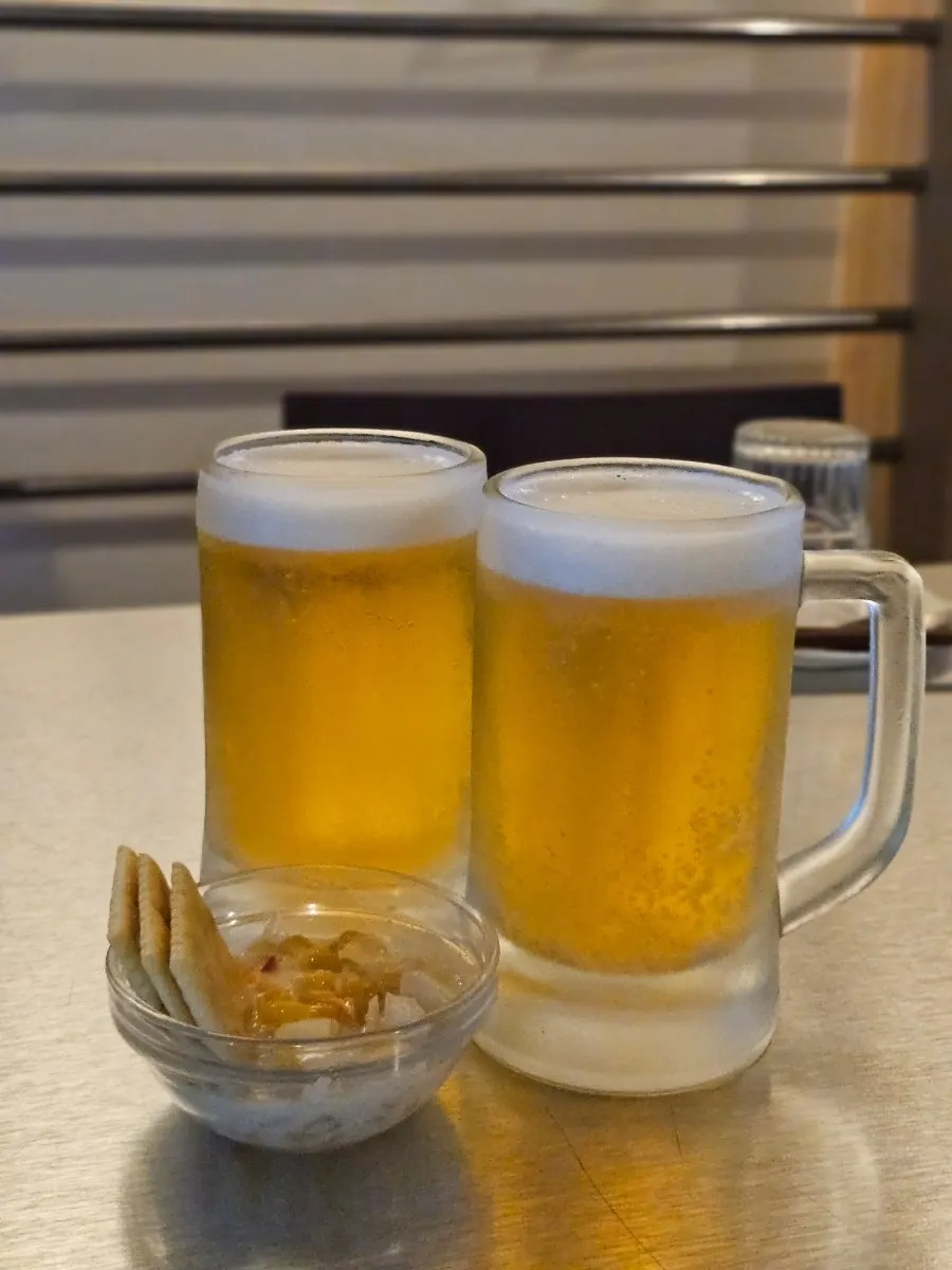 Basic side dish and draft beer at Thai Yami