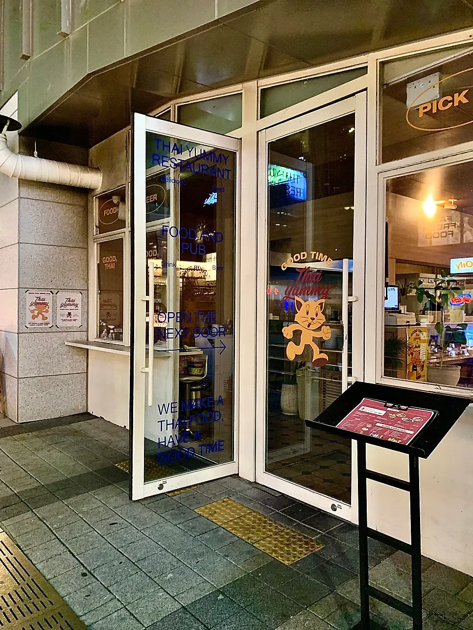 Thai Yami's first-floor storefront with a full-glass entrance