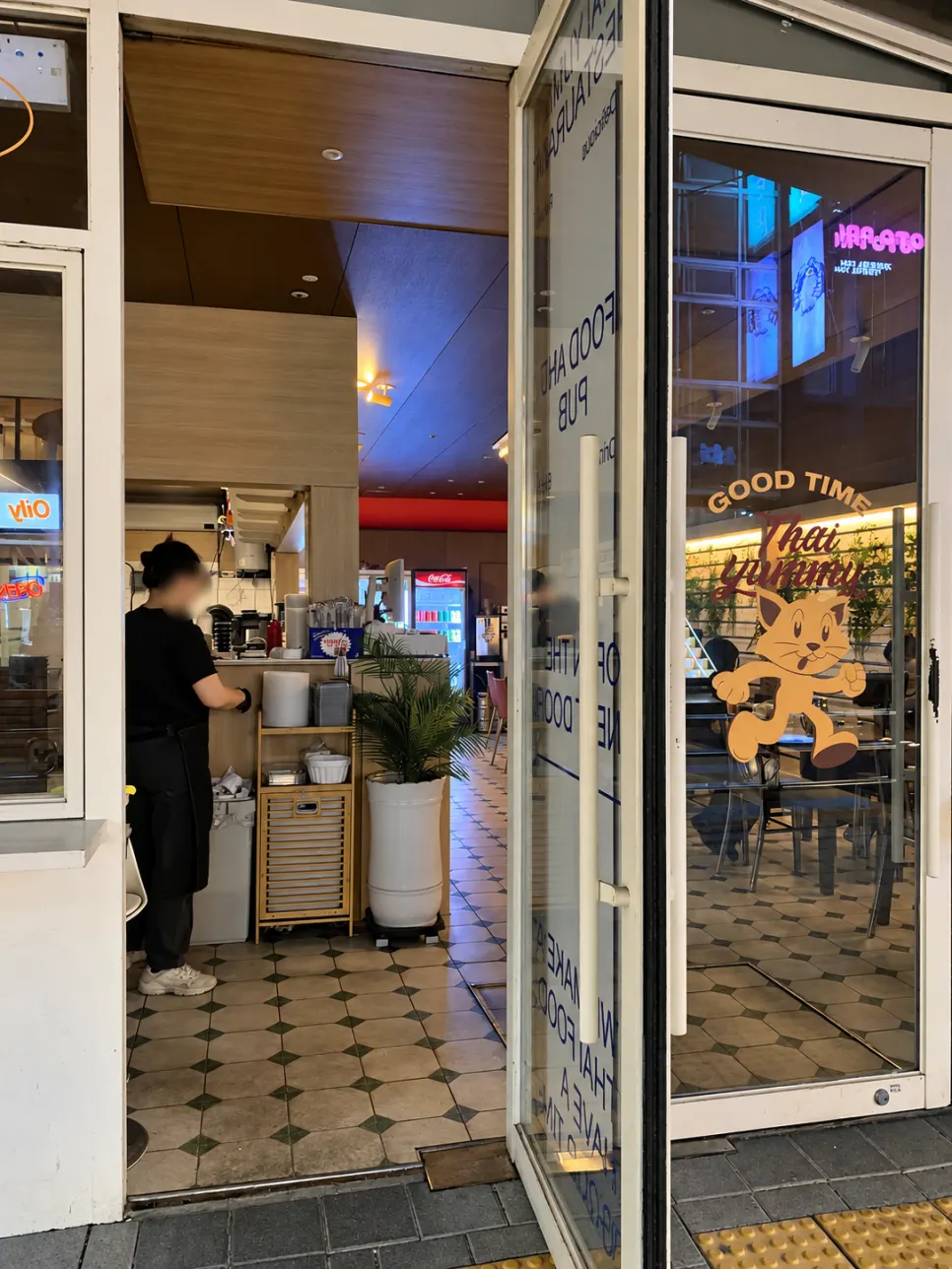 Thai Yami's wide-open entrance and menu board