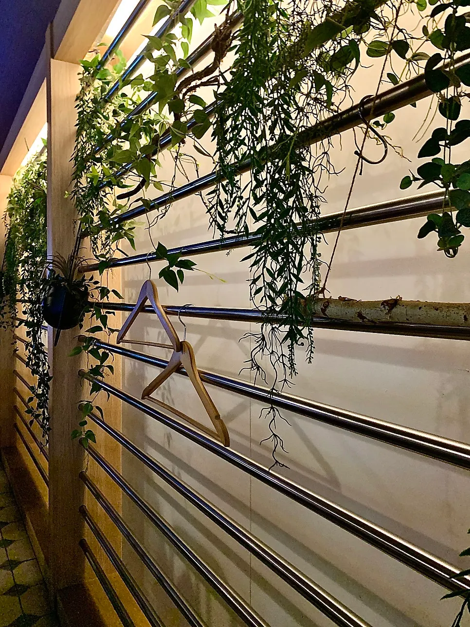 Thai Yami's wood-toned wall decorated with character posters