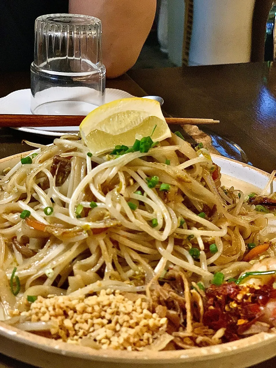 A plate of Thai Yami's pad thai served with lemon