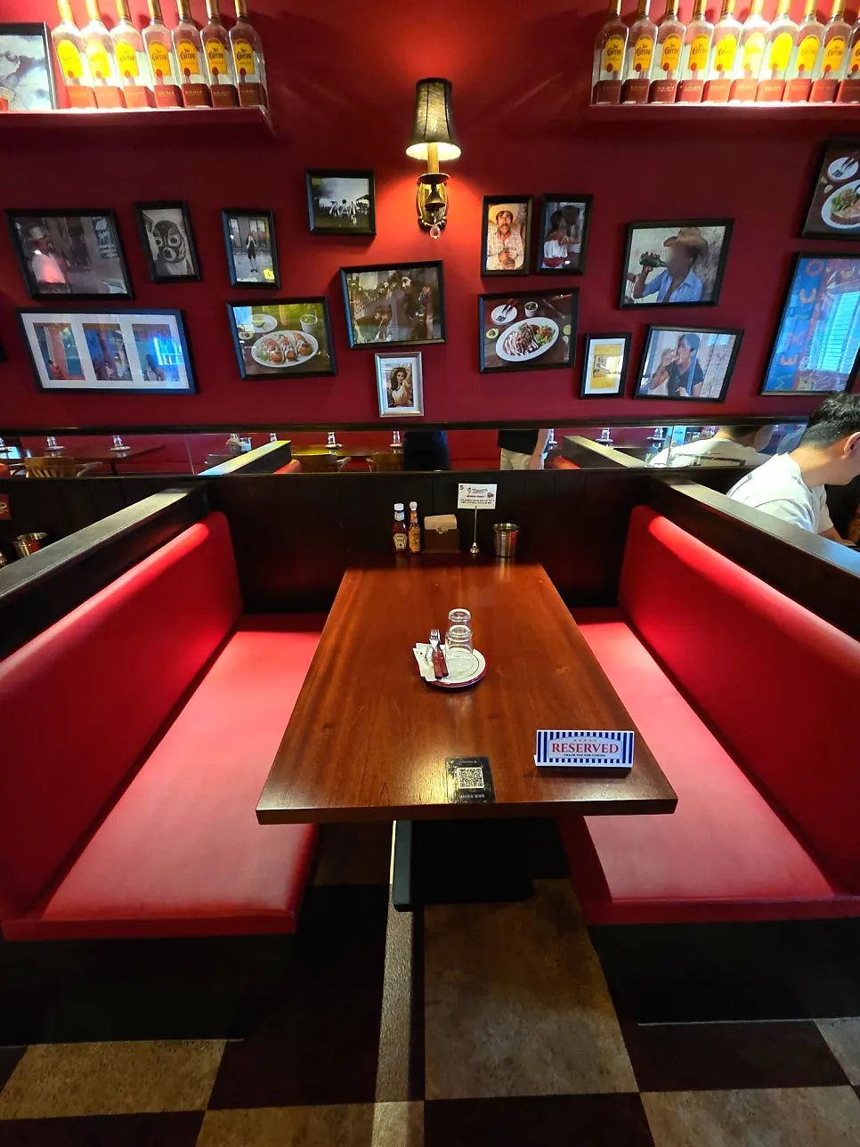 Red booths and wood-tone table seating