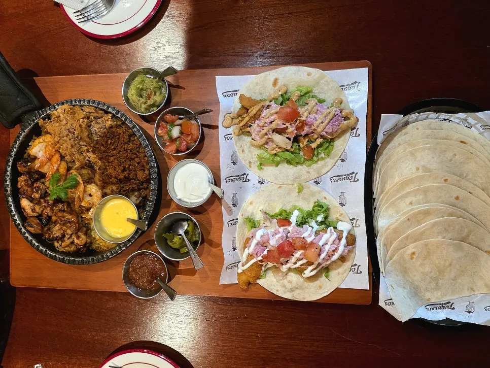 Full spread of the couple set fajitas and tacos