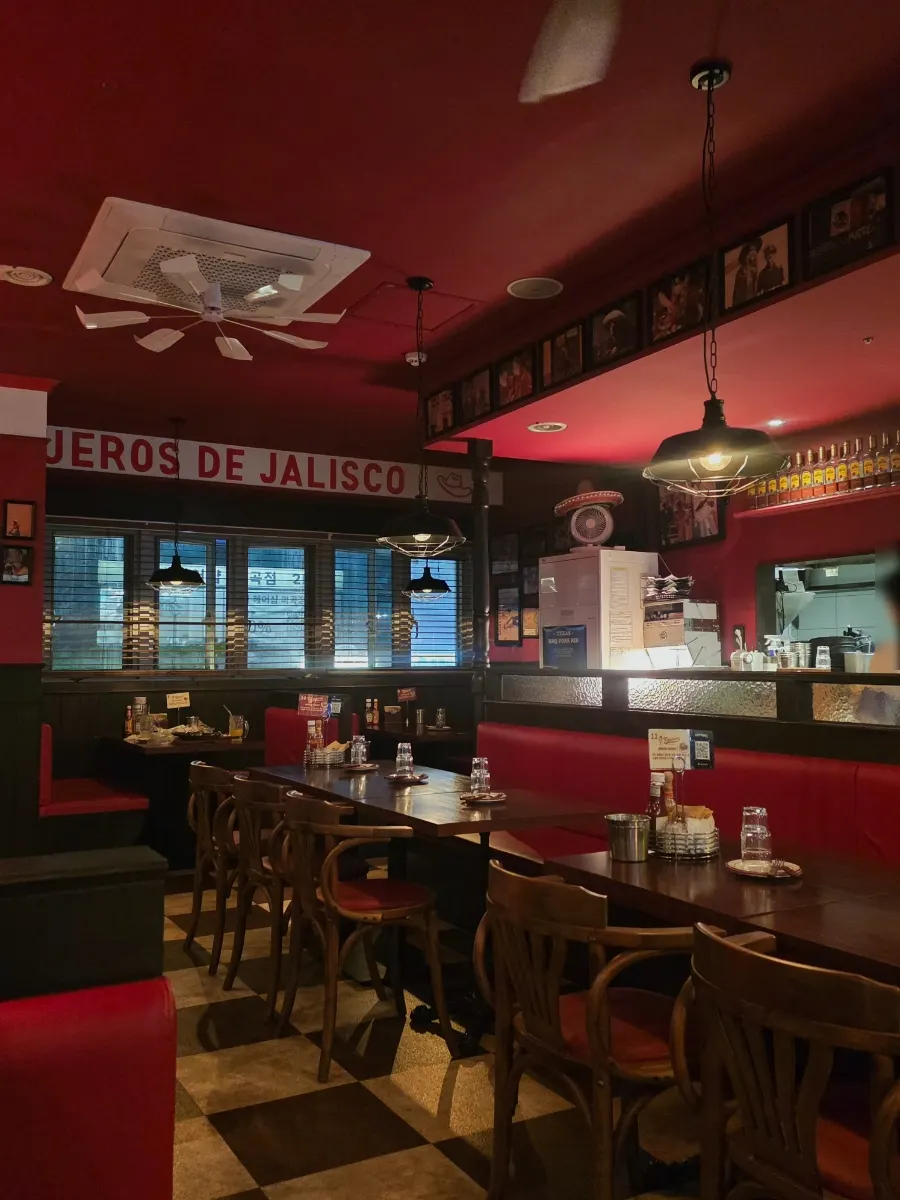 Red-toned interior of Taqueros Magok Main Branch