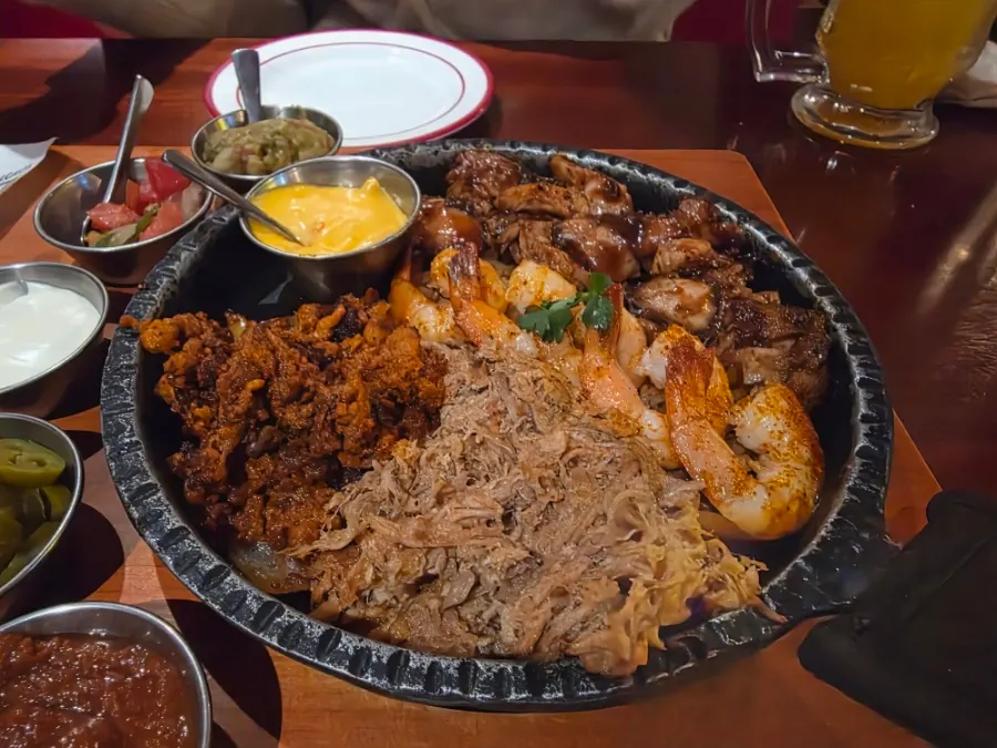 Fajita served with meats and accompanying sauces