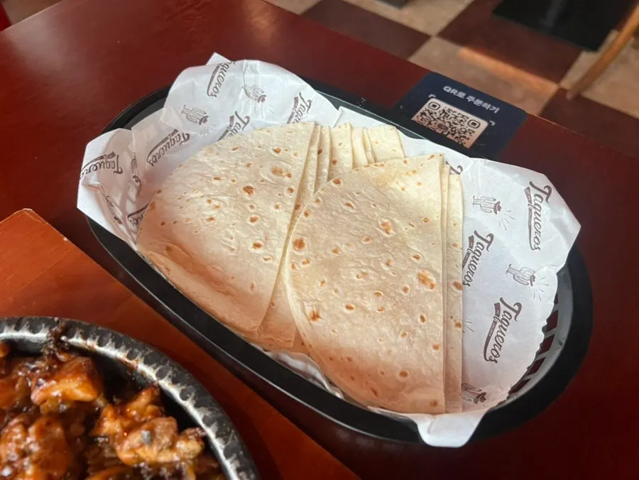 Close-up of chicken taco topped with sauce