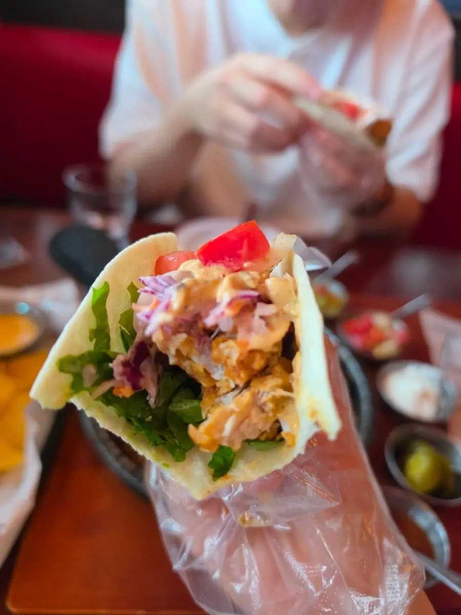 Fish taco served with tartar sauce