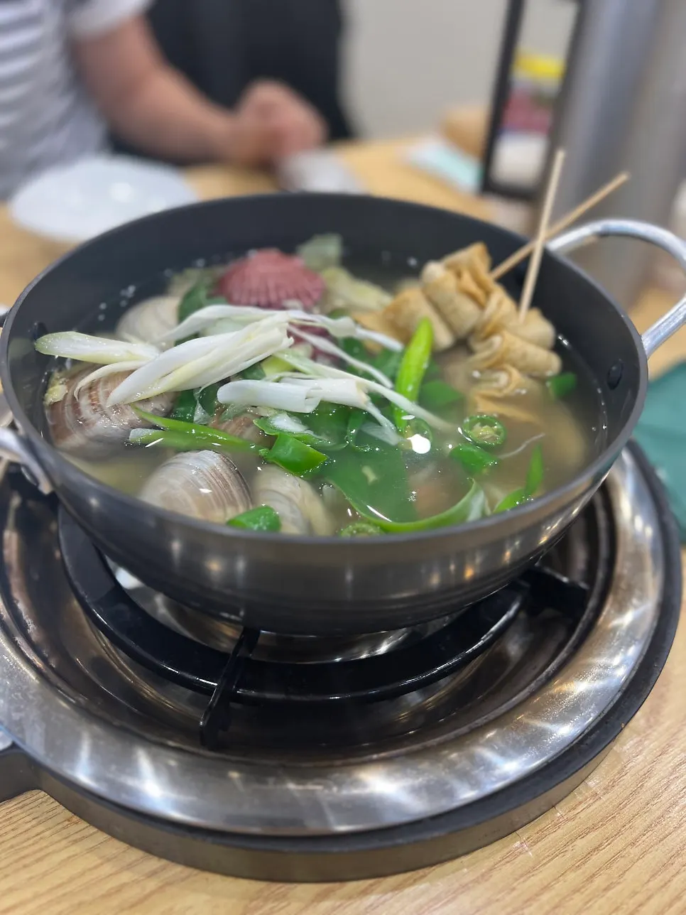 Large clam hot pot set on the burner