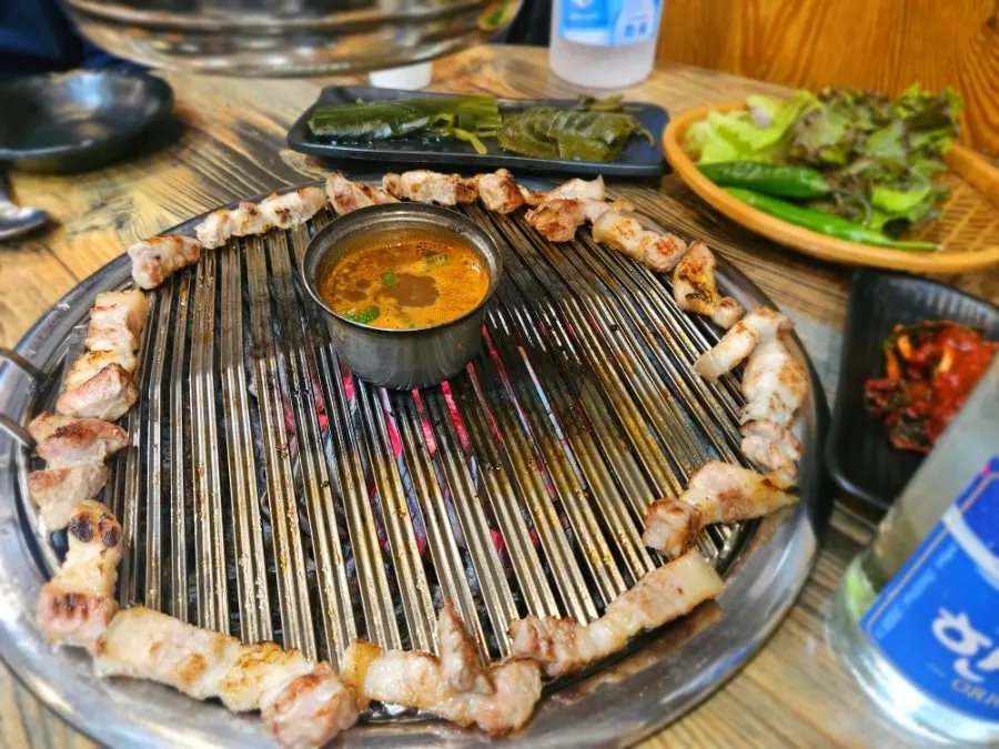 Pork belly grilled to near-perfect doneness by staff