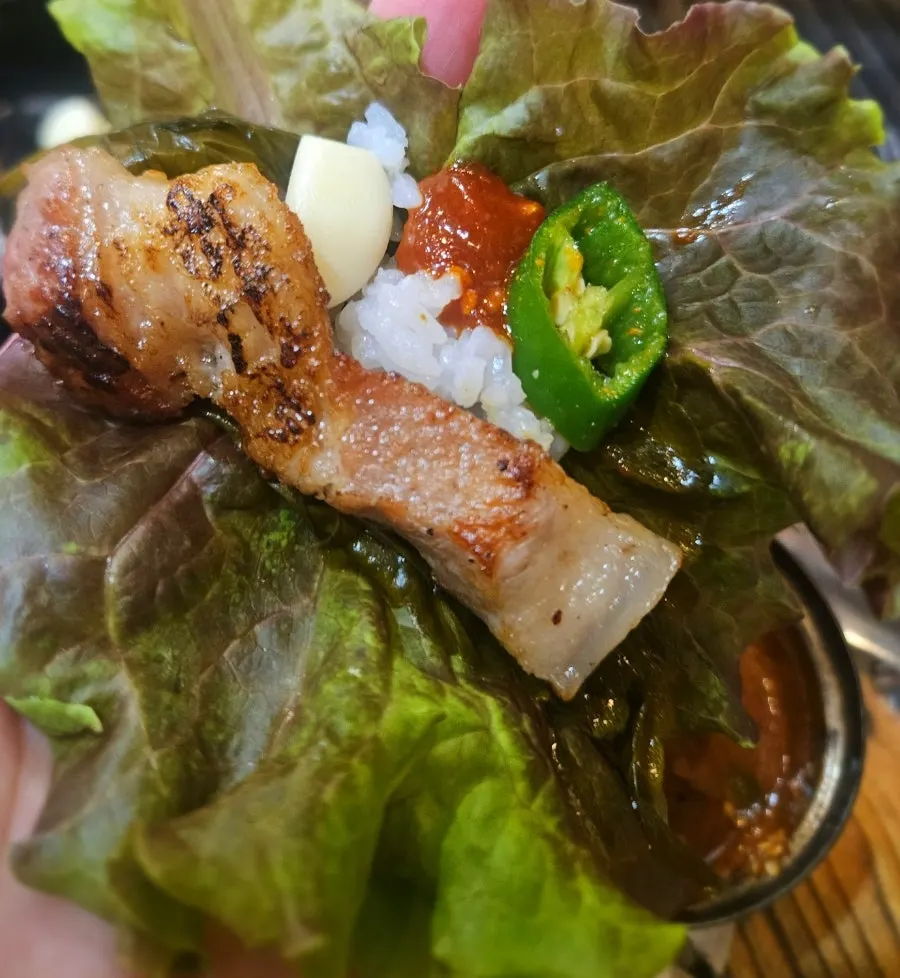 Table setting with grilled meat and rice