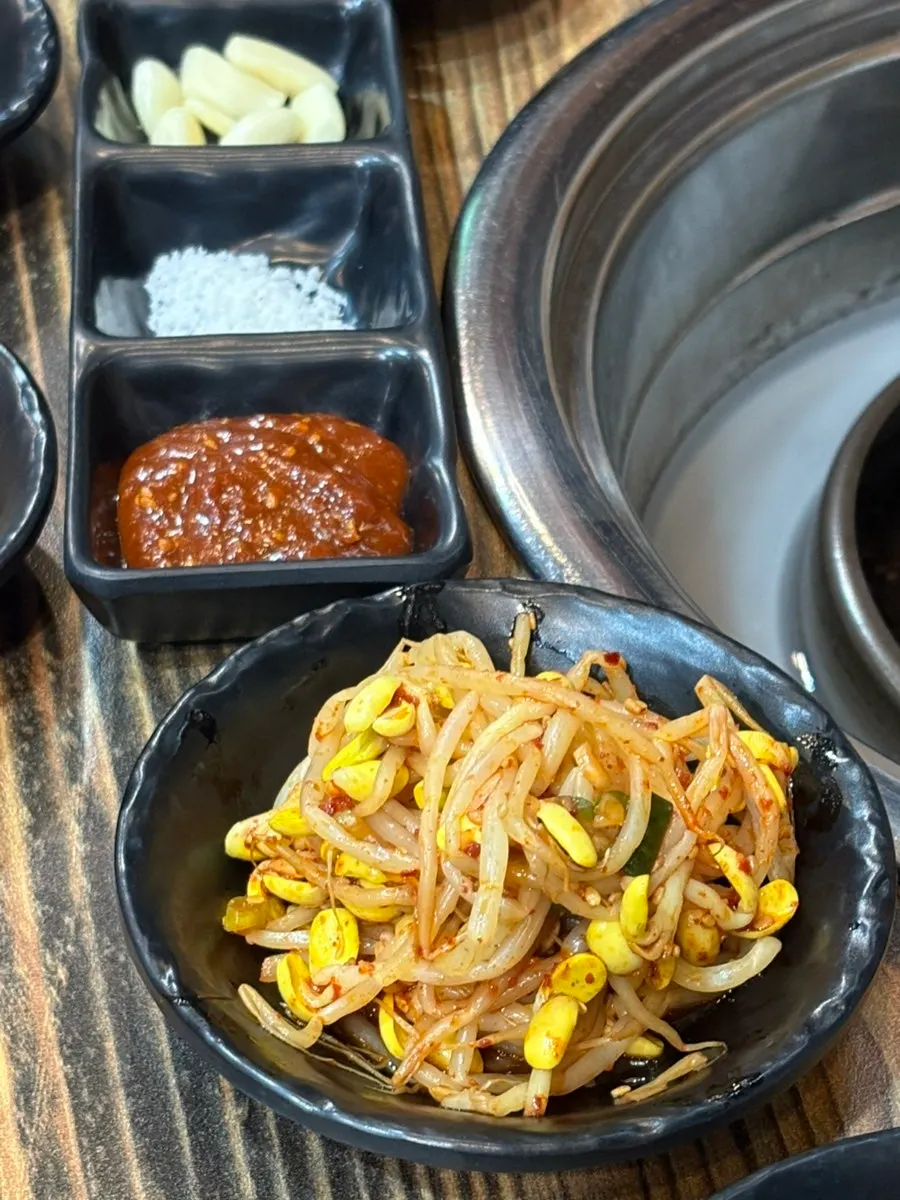 Banchan setup with wild garlic leaf and lettuce wraps