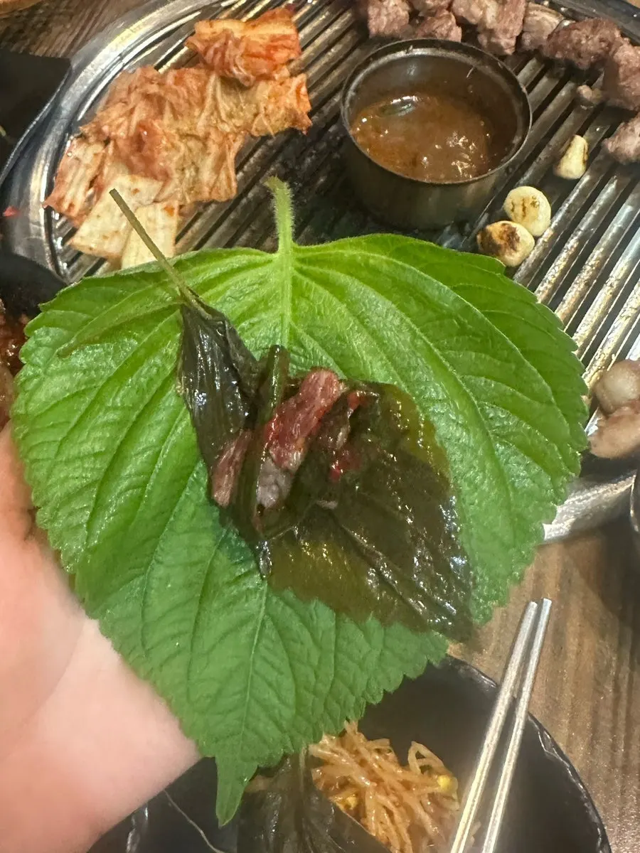 Lettuce wrap topped with garlic and green onion kimchi