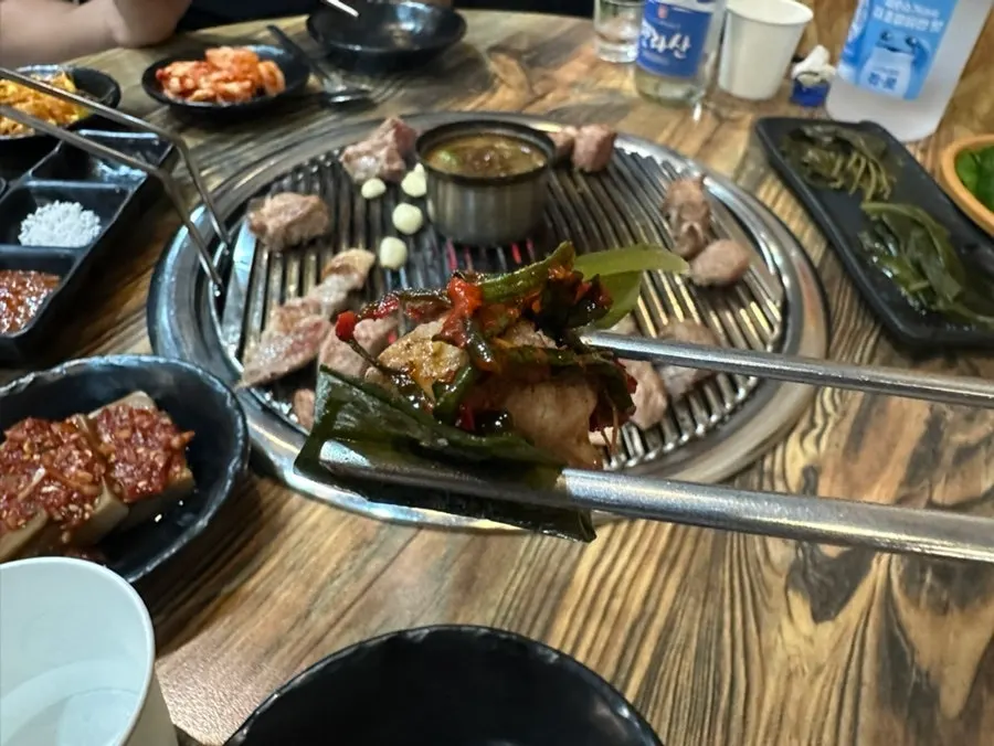 A piece of Jeju pork neck dipped in melchet