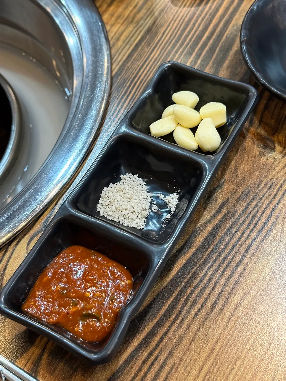 Plate of standard side dishes served with the pork neck