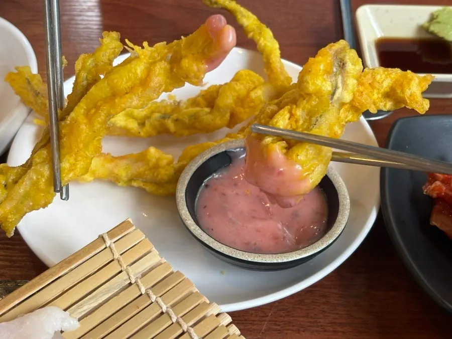 Plate of shrimp sashimi and cutlassfish sashimi