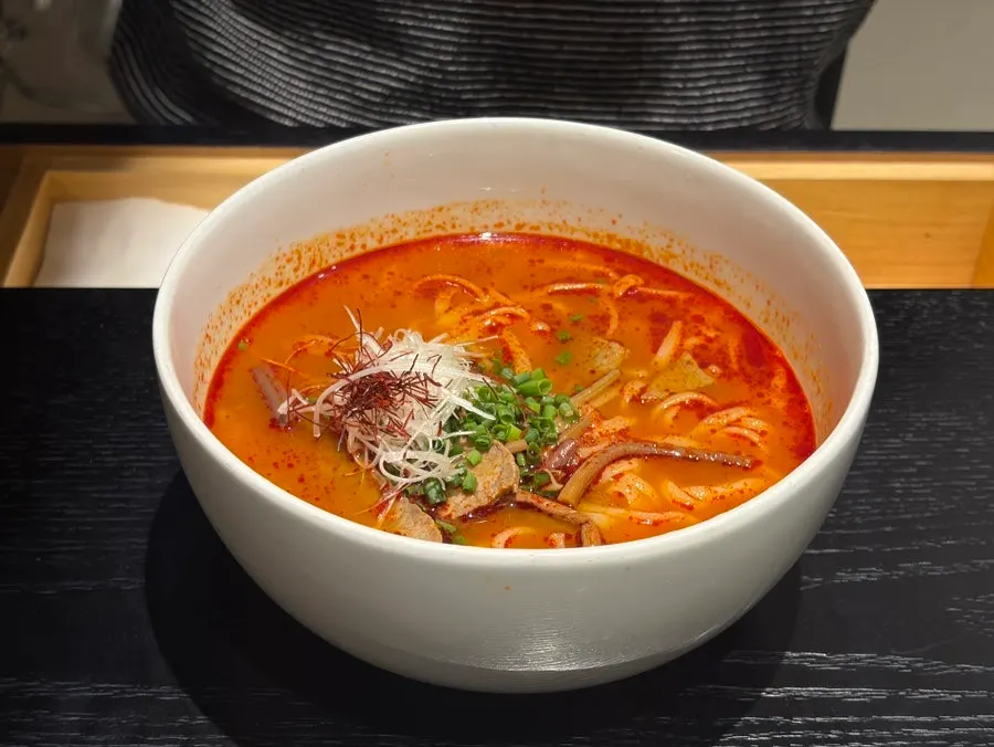 Two bowls of kalguksu with toppings at Tanbaek