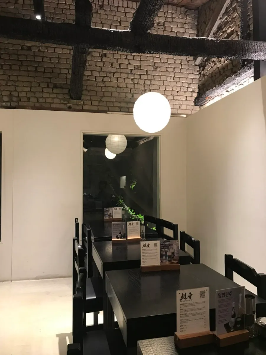 Wooden pillars and lighting inside the restaurant