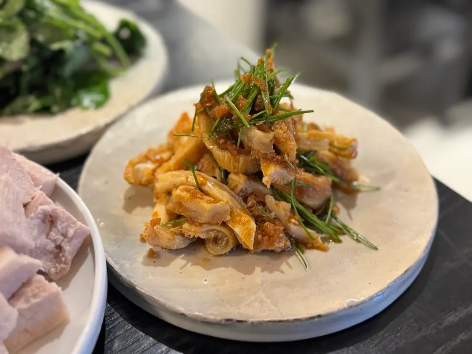 Close-up of the warm pork jowl plate at Tanbaek